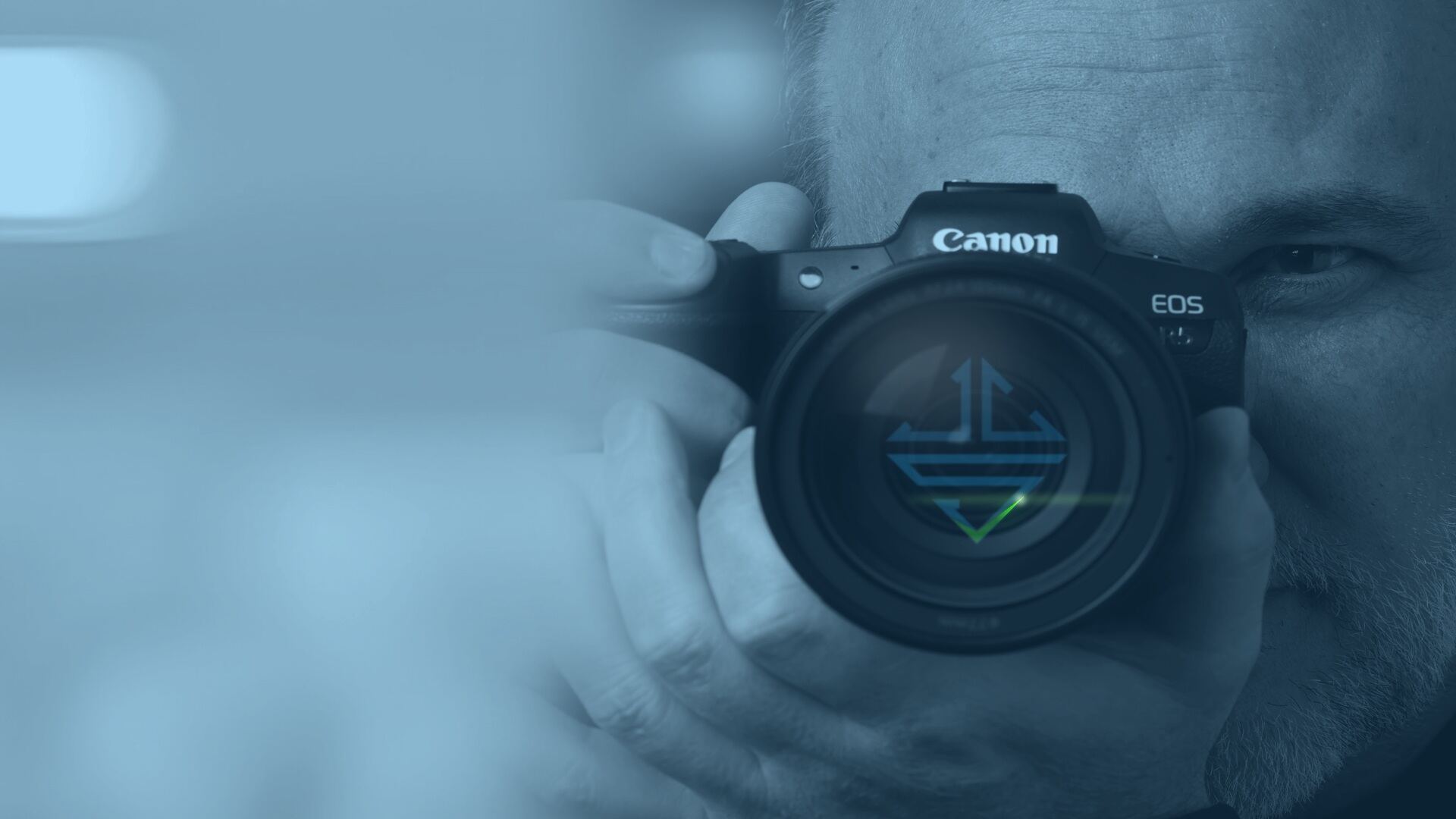 VCS photographer with the VCS mark reflected in the camera lens