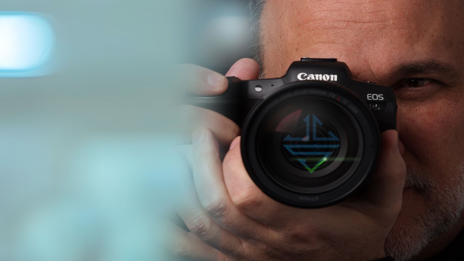VCS photographer with the VCS mark reflected in the camera lens